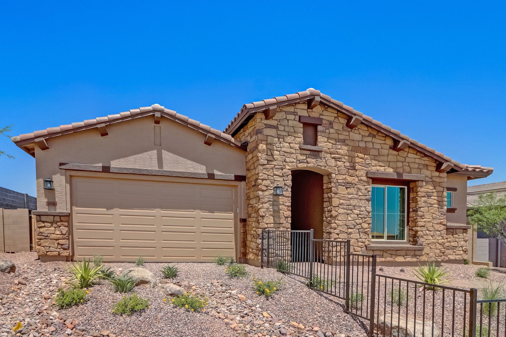 Canyon Views Hacienda Topaz home with stone facade at 20044 W El Nido Ln.:Elegant stone facade and tile roof enhance this Canyon Views home at 20044 W El Nido Ln.