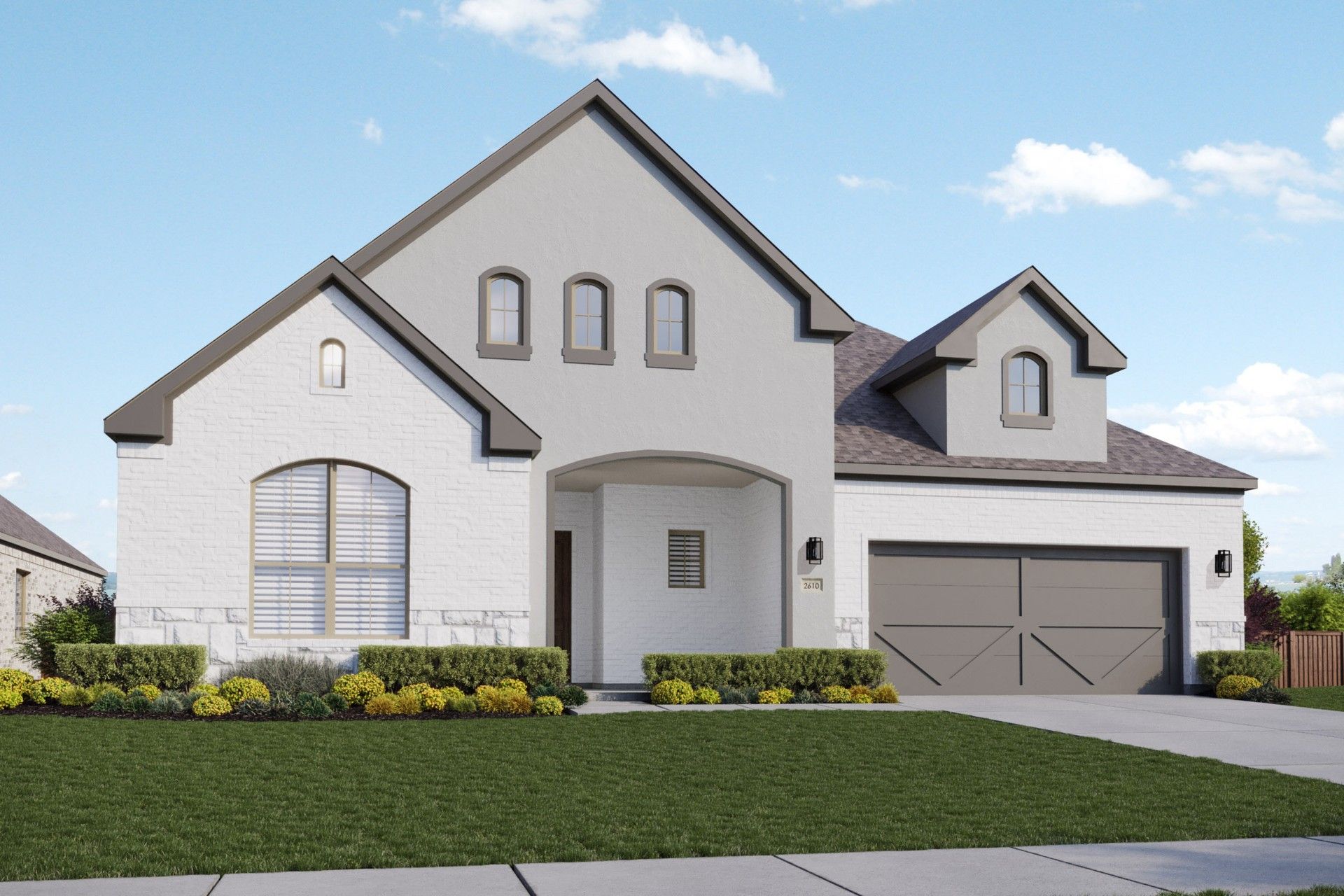White Brick Home with Gabled Roof in Kelly Ranch Rio Vista:Experience luxury in this white brick home with arched windows and a gabled roof at Kelly Ranch Rio Vista.
