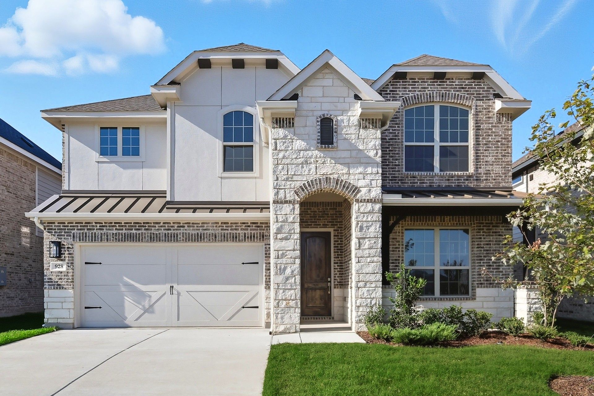 Wildflower Ranch Magnolia Plan Home at 928 Schuberts Road:Stunning stone and brick exterior of Magnolia plan in Wildflower Ranch, 928 Schuberts Road.