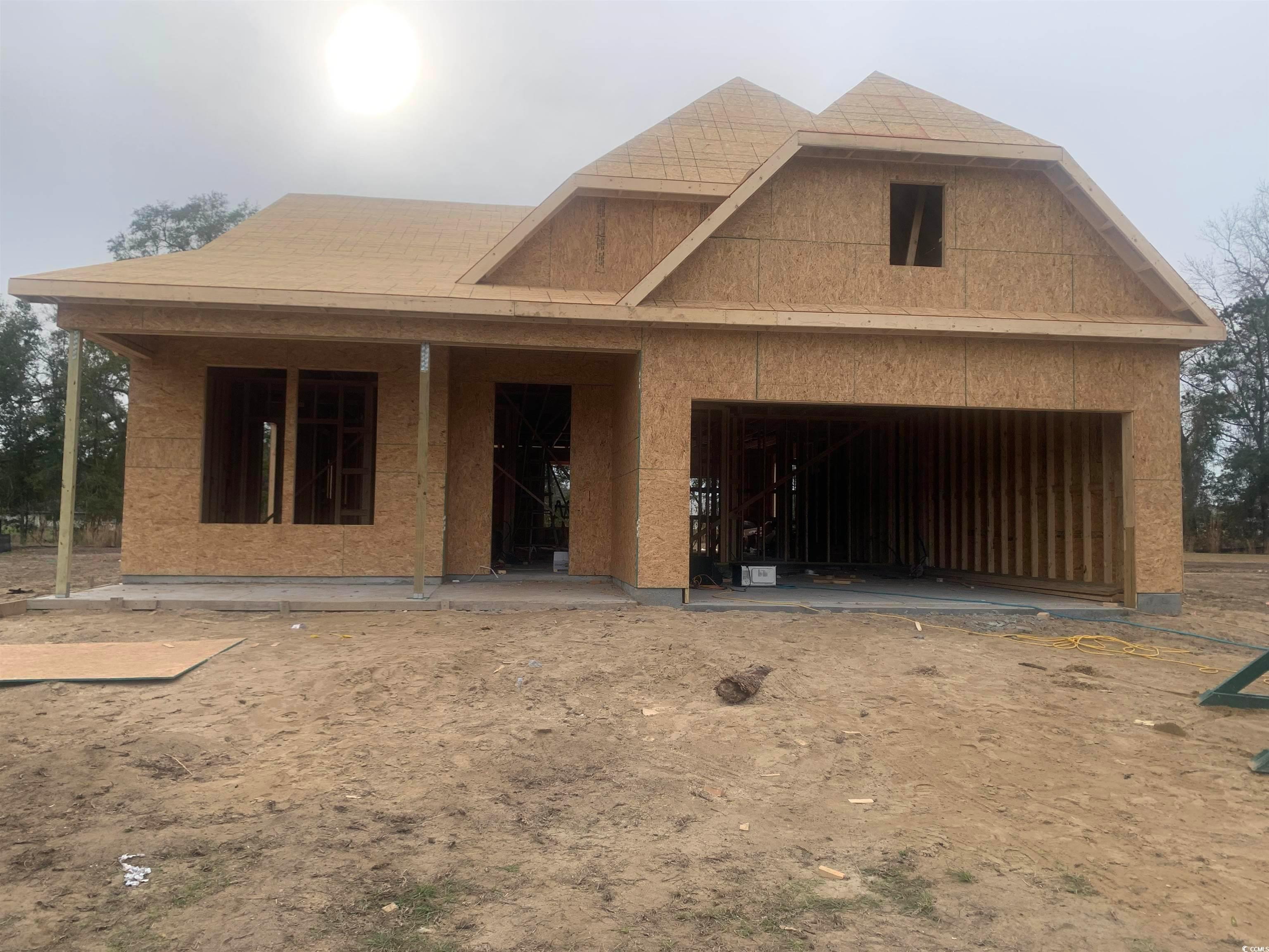 Exterior:View of front facade with a garage