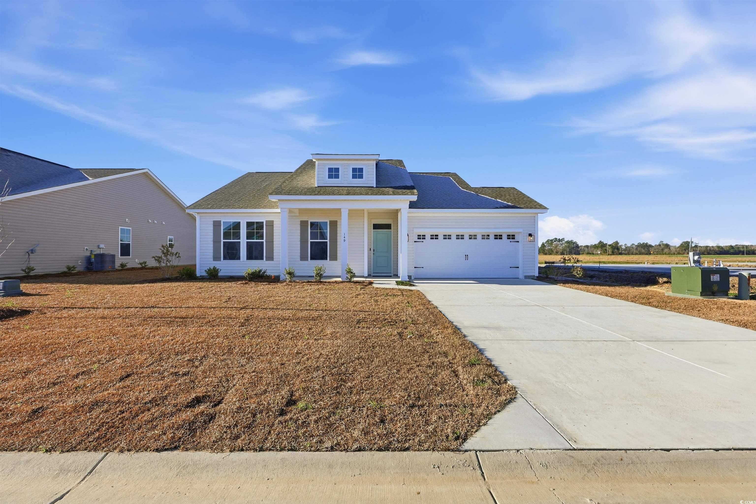 Exterior:View of front of home with driveway, a porch, roof with shingles, and an attached garage