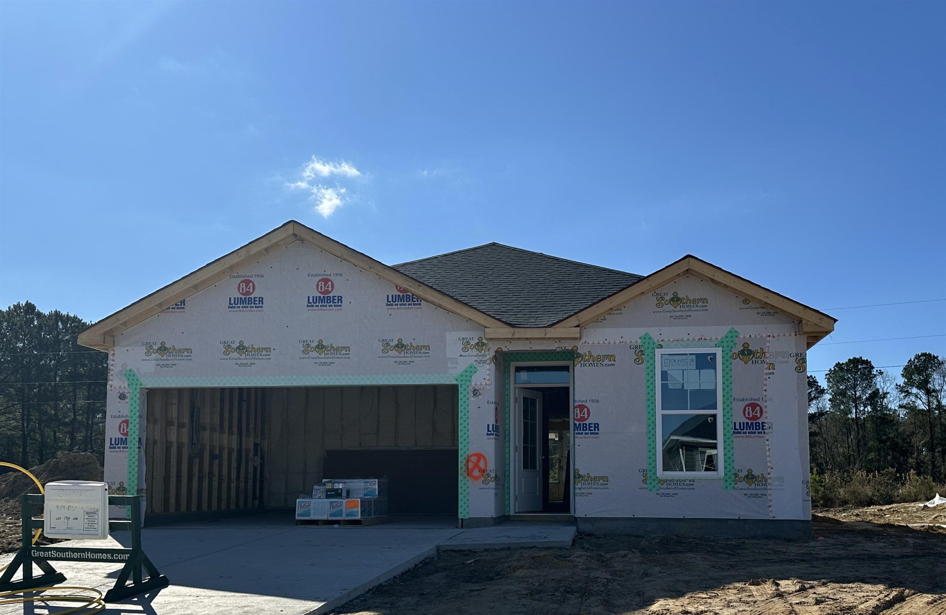 Exterior:Property under construction featuring concrete driveway and a garage