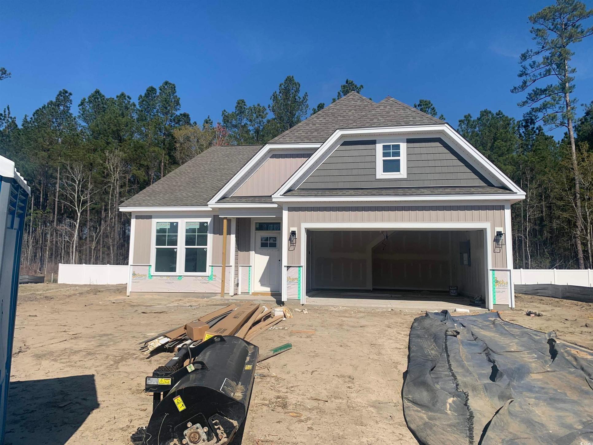 Exterior:View of front facade with a garage