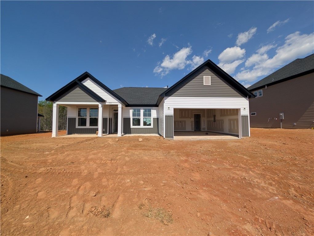 Exterior:This new construction home boasts a modern facade,