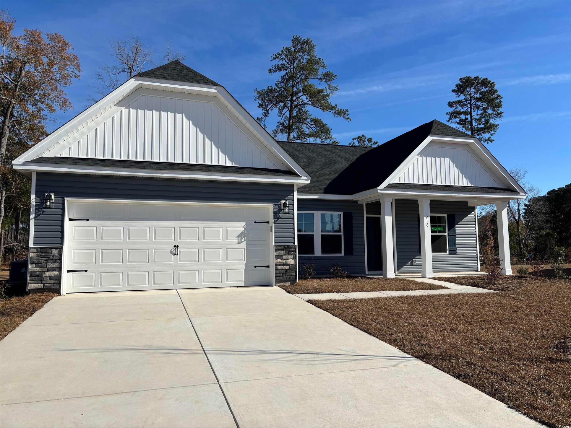 Exterior:View of front facade with a garage