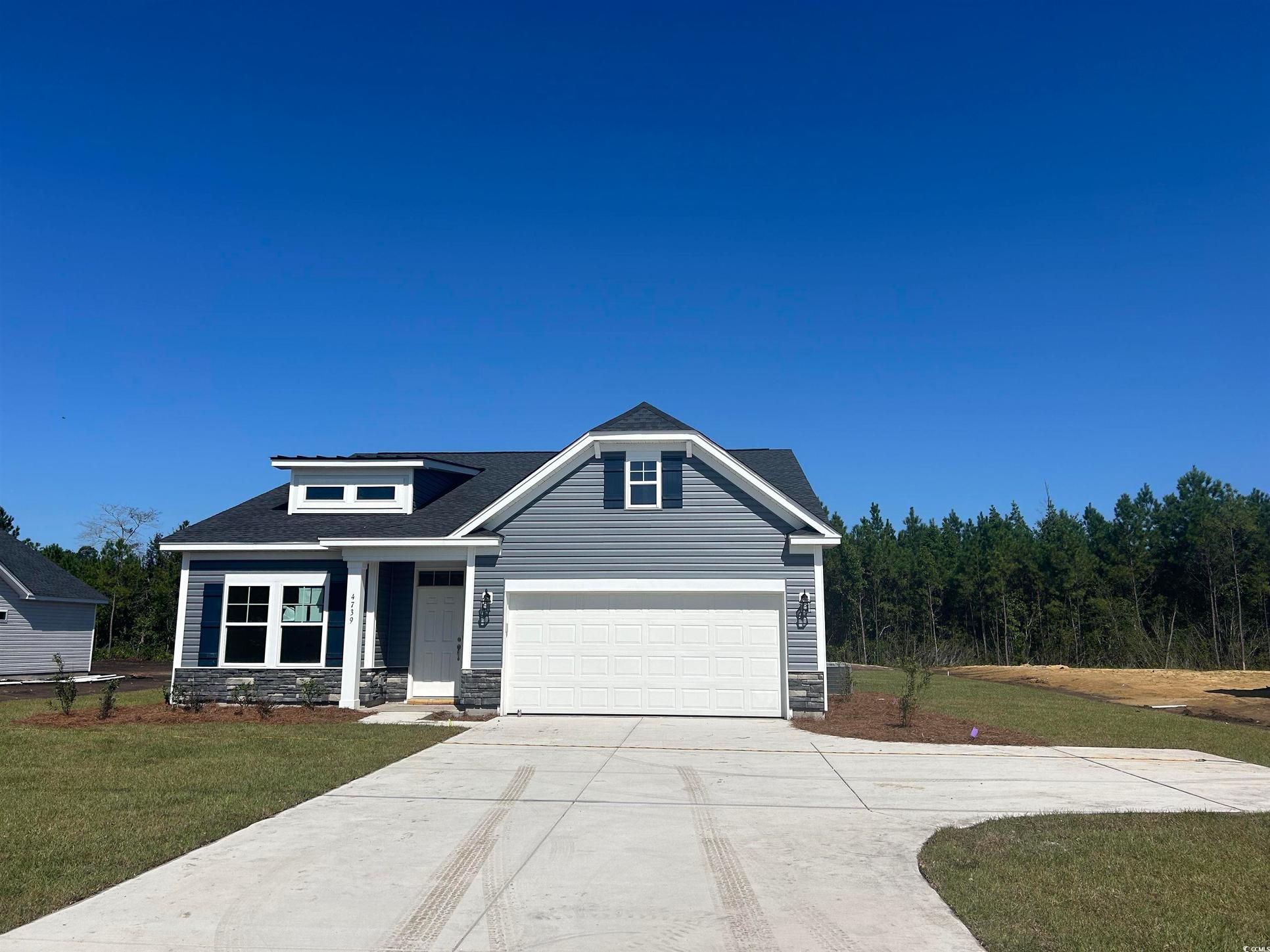 Exterior:Craftsman house featuring a front yard