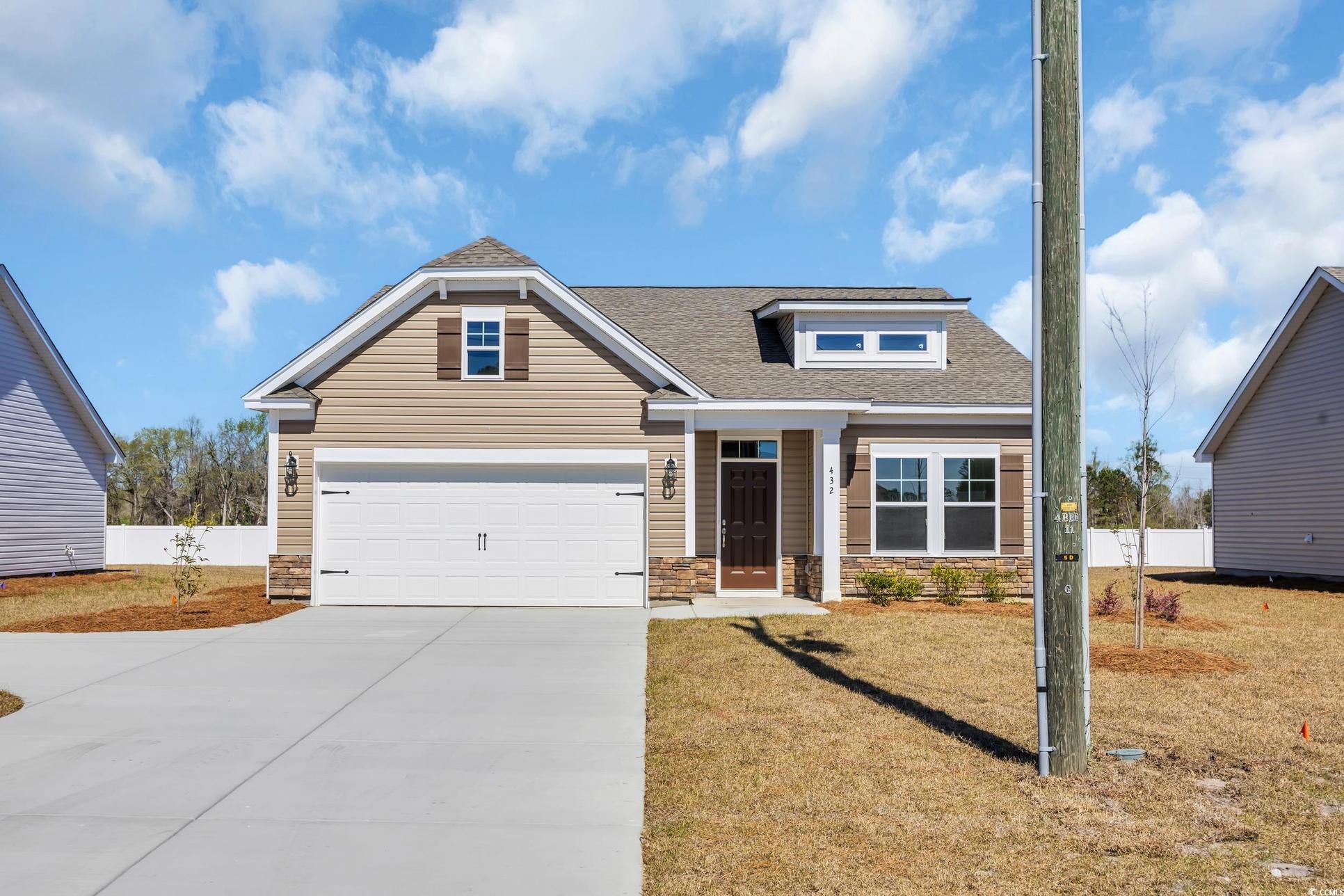 Exterior:Craftsman-style home with stone siding, a shingled roof, fence, and concrete driveway