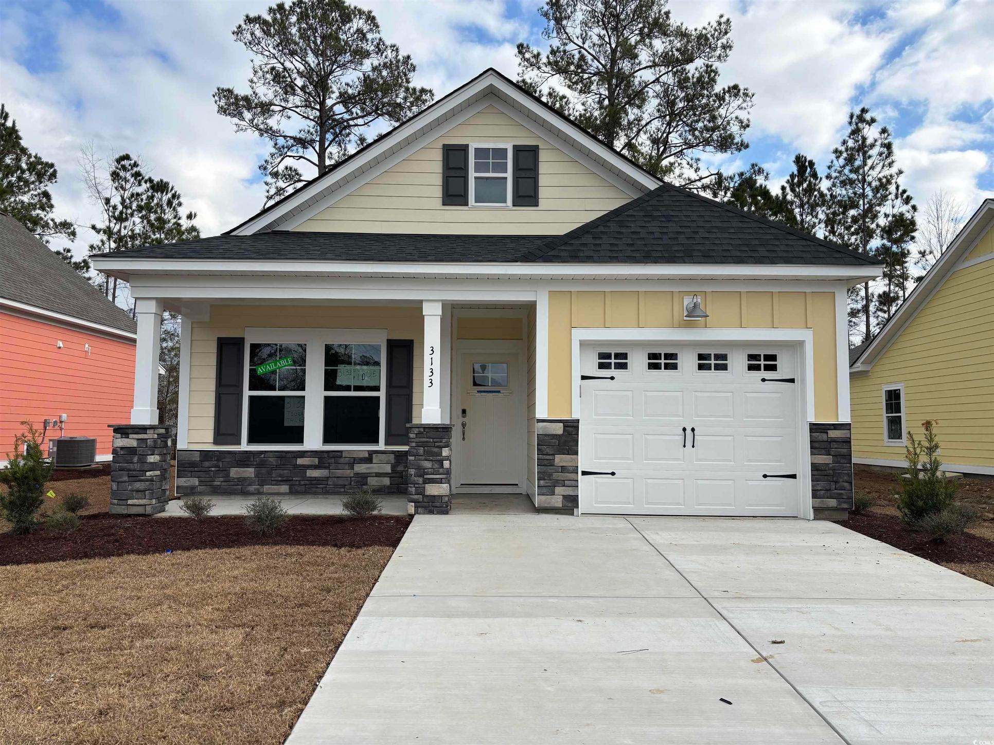 Exterior:Craftsman-style house featuring a porch, central AC, and a garage