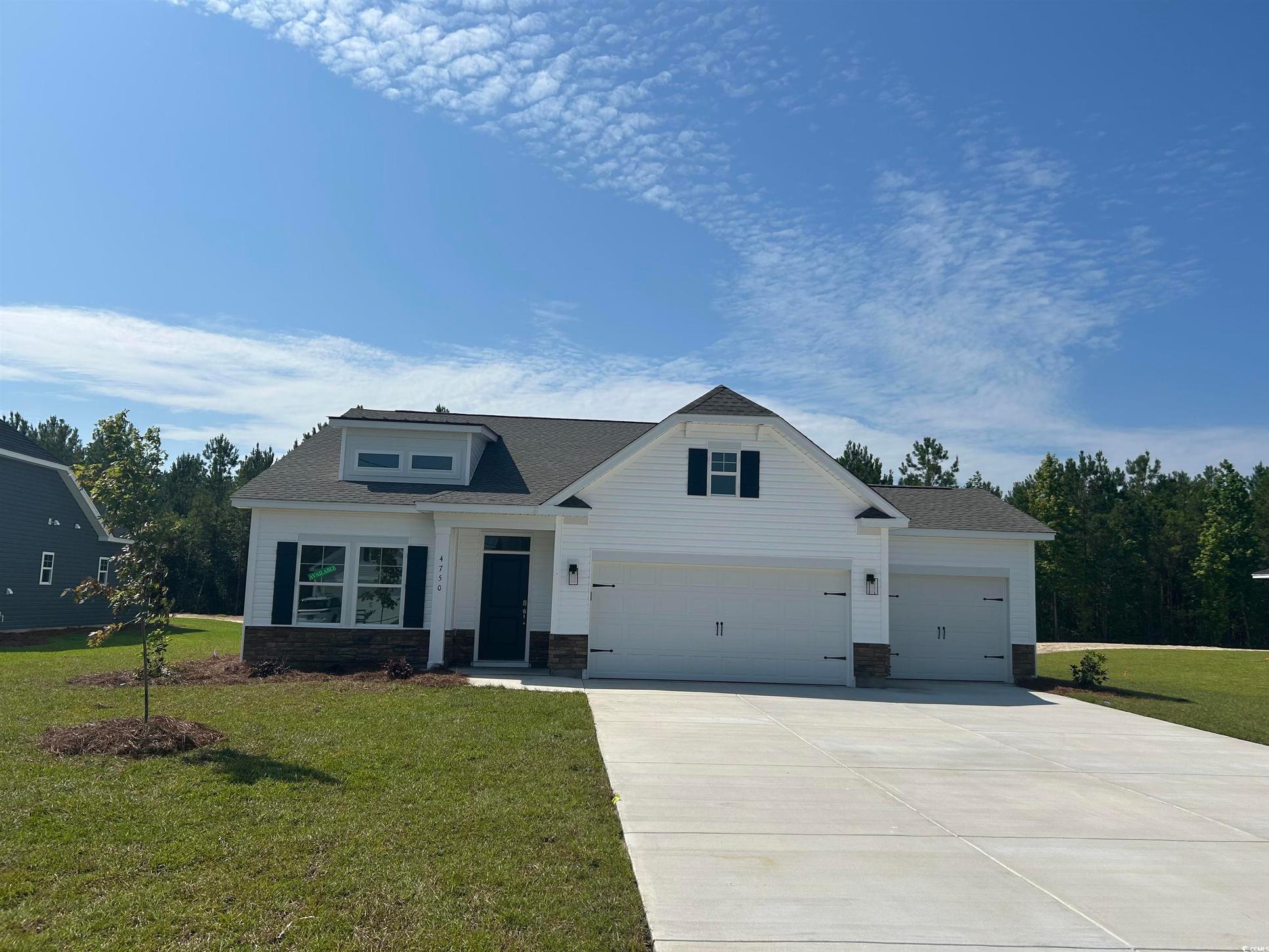 Exterior:Modern farmhouse style home with driveway, a front lawn, a shingled roof, stone siding, and an atta