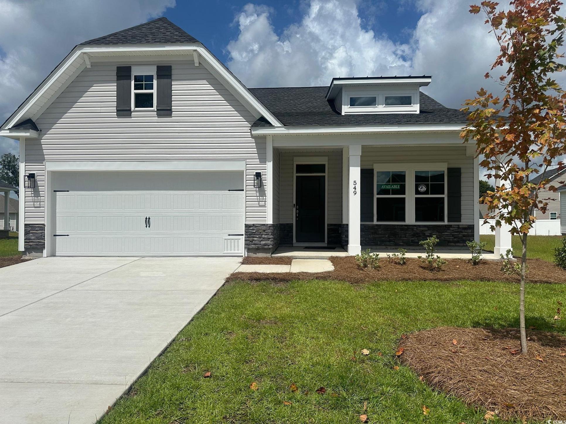 Exterior:View of front of property with stone siding, roof with shingles, a porch, and a front yard