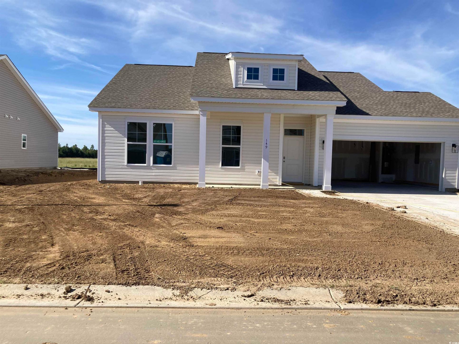 Exterior:View of front facade with a porch, a shingled roof, driveway, and a garage