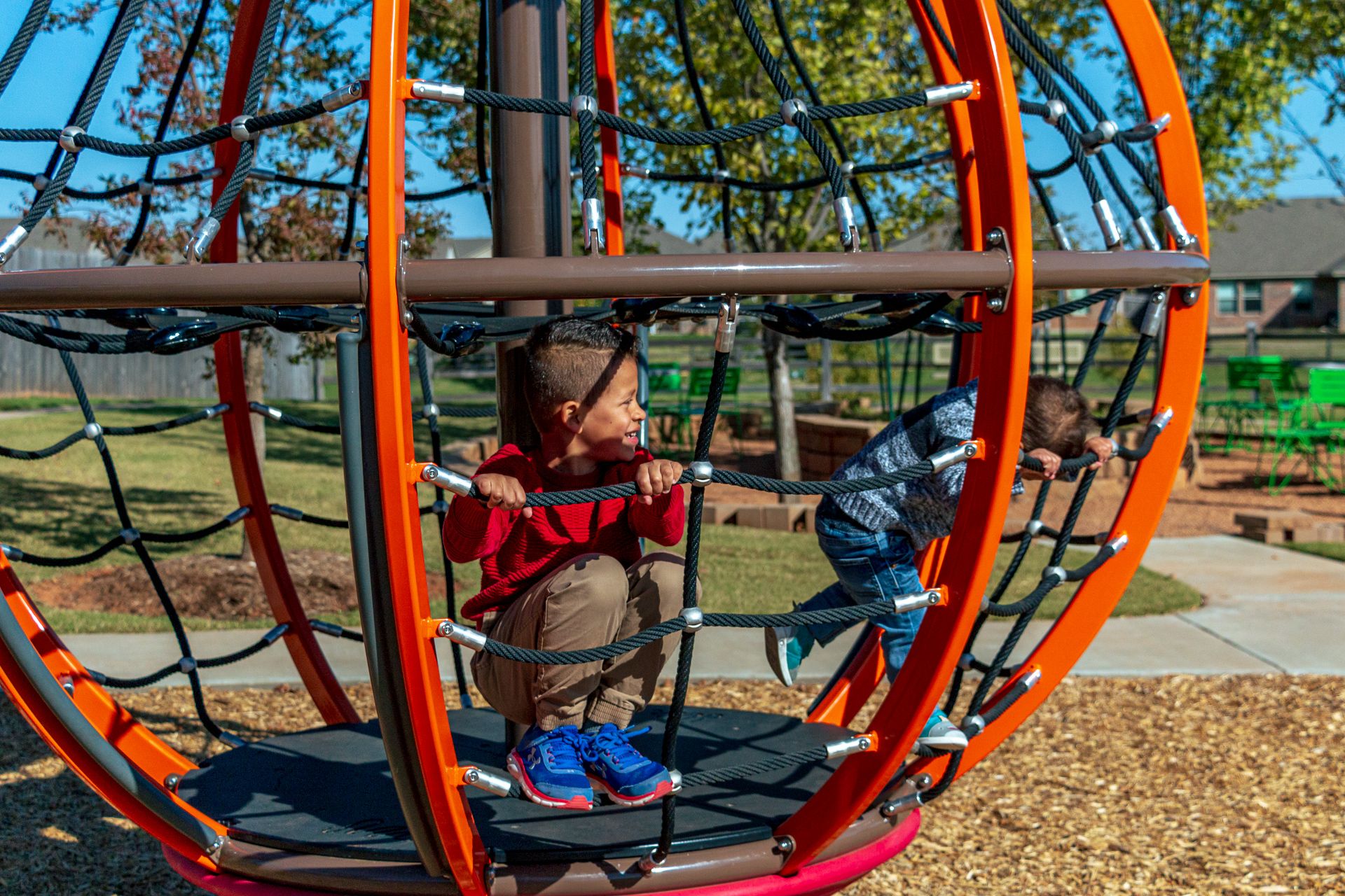 Children playing at playground in Greenleaf Trails - new homes in Norman, ok