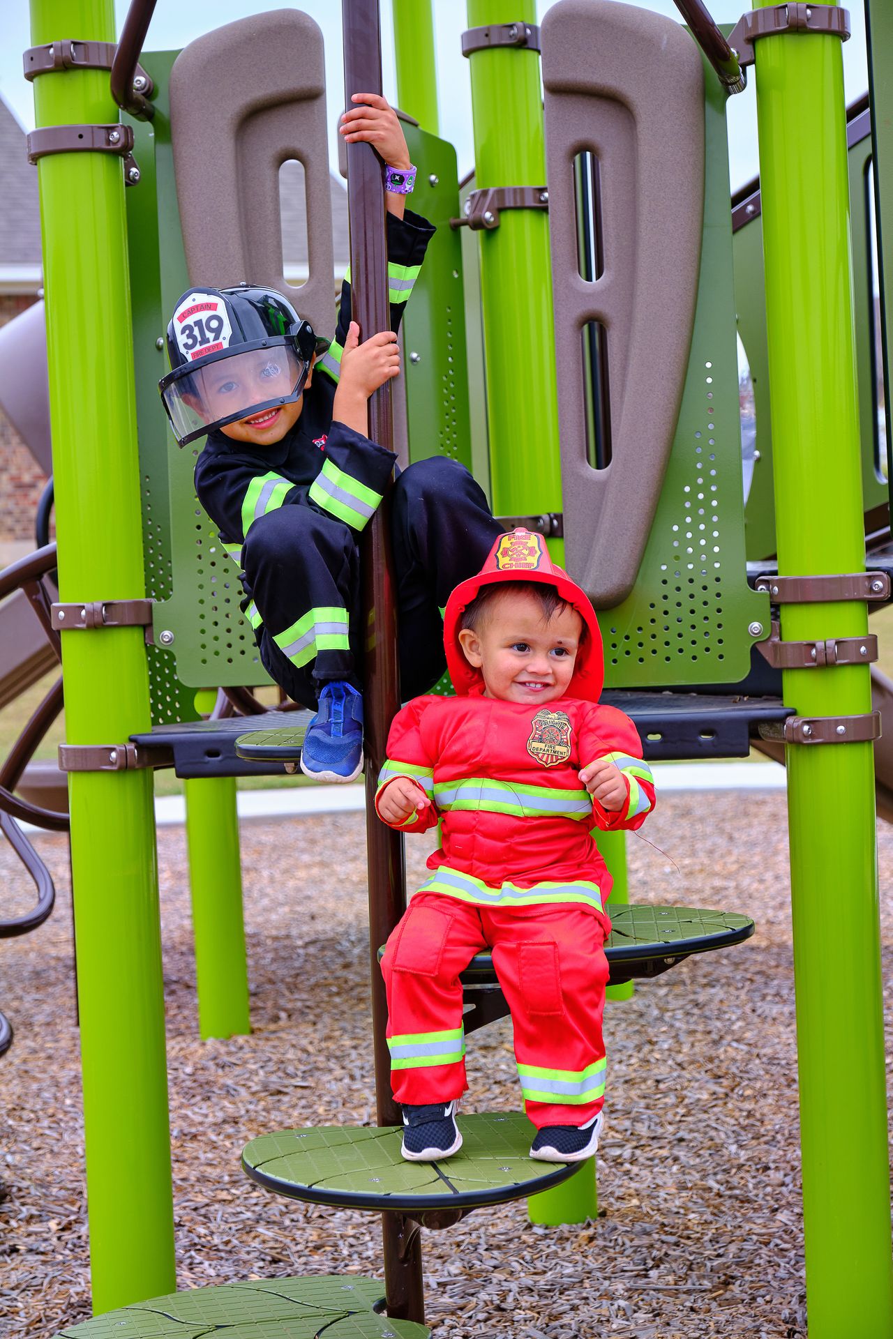 2 boys playing on playground in Oasis Ranch:Playground in Oasis Ranch