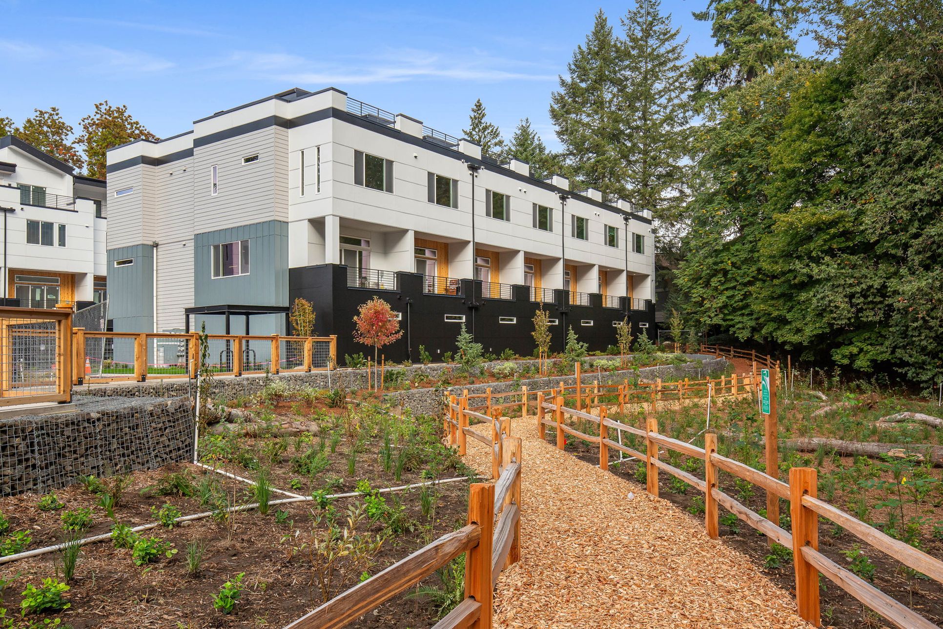 Verdyn:Back of Building 2, along with the green space and community trail