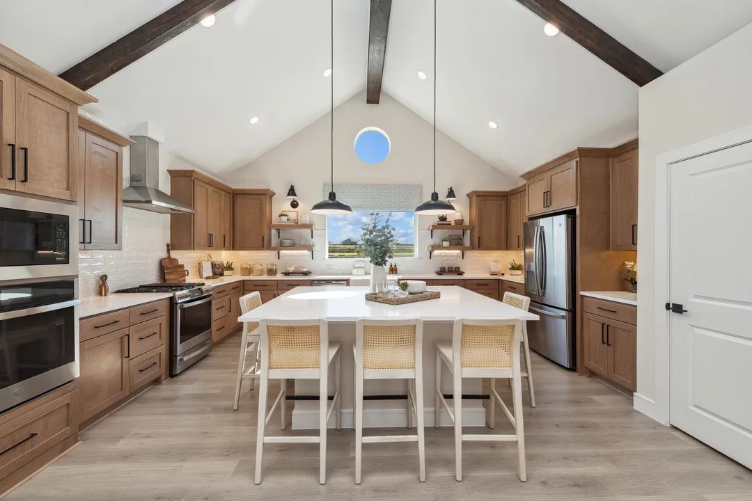 Interior:Kitchen with pendant lights and vaulted ceilings