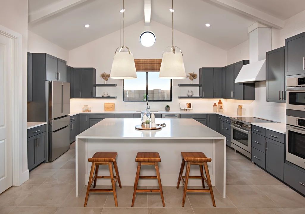 Interior:Kitchen with waterfall island and pendant lighting