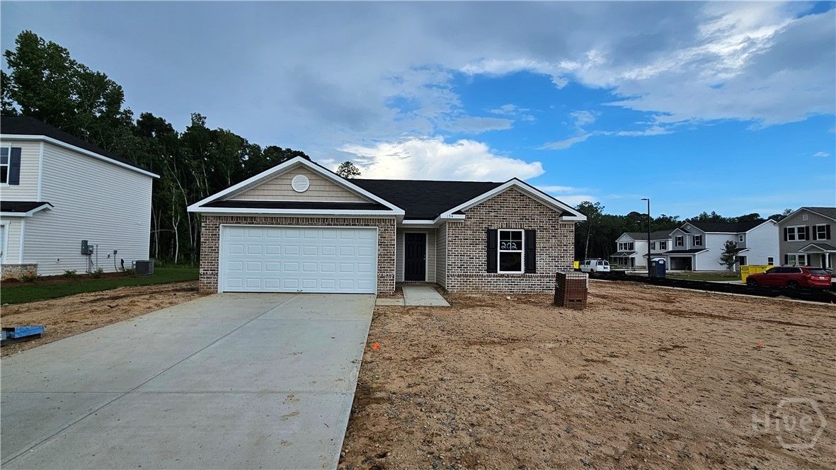 Exterior:Front View - Pre Landscaping - Photo taken 6/13/2025