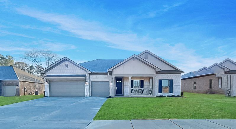 Exterior:brick home exterior with 3 car garage