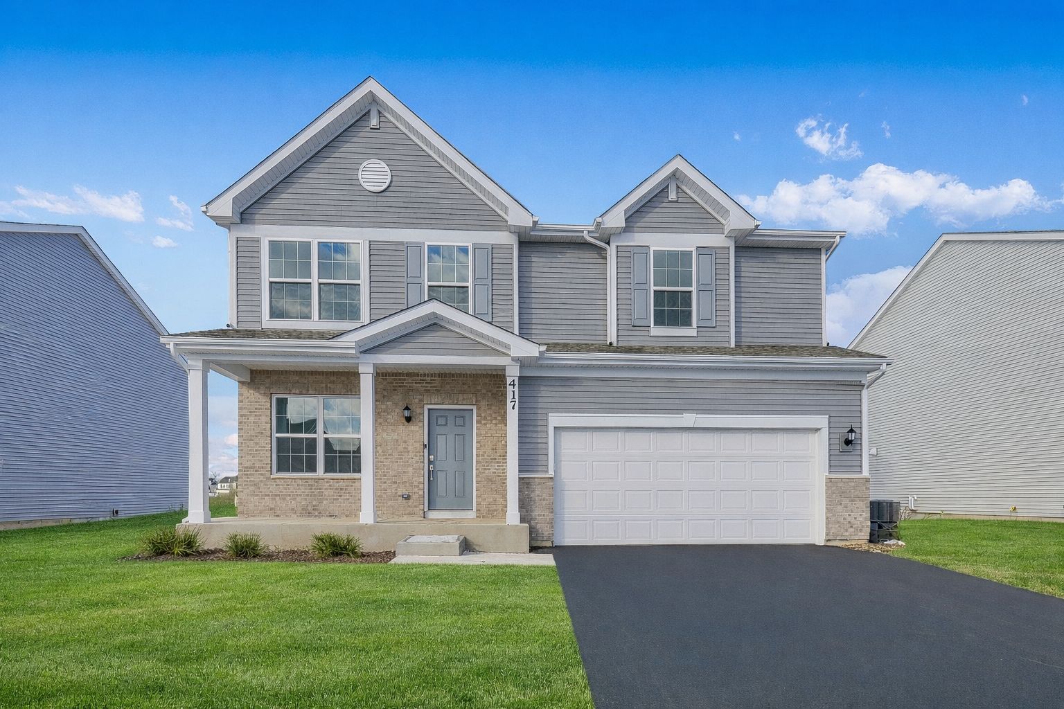 Exterior:Suburban home with inviting front porch