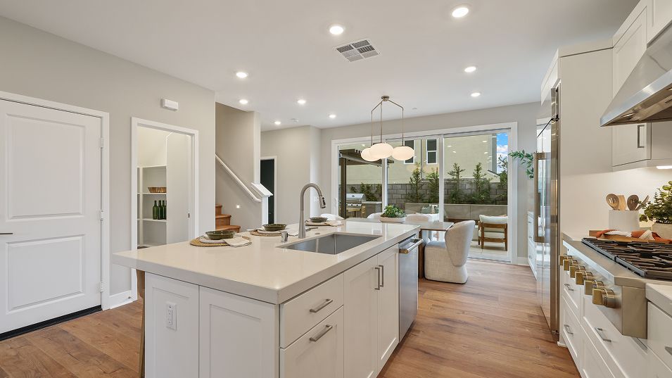 A generous walk-in pantry provides convenient culi