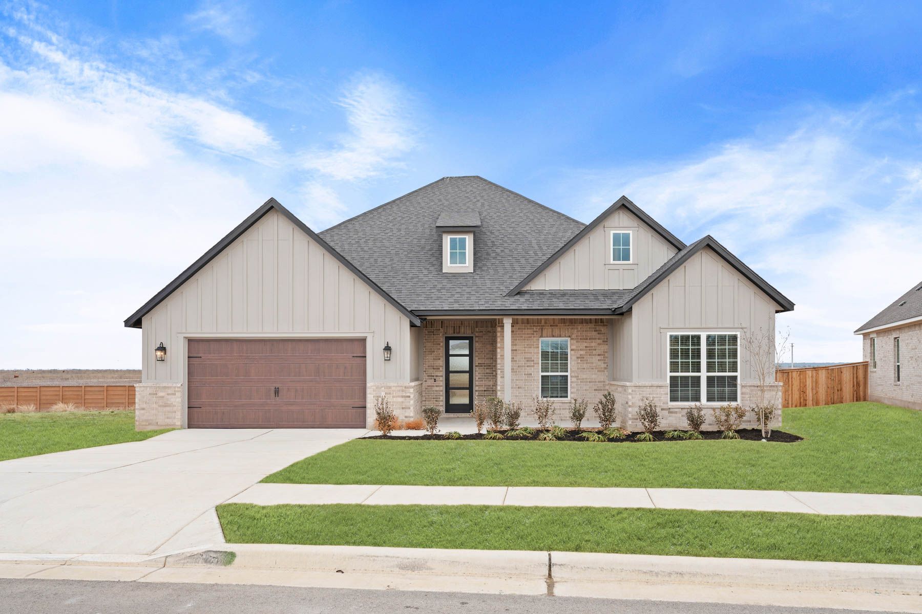 The Fairview by Terrata Homes:Beautiful one-story home with a brick and siding exterior.