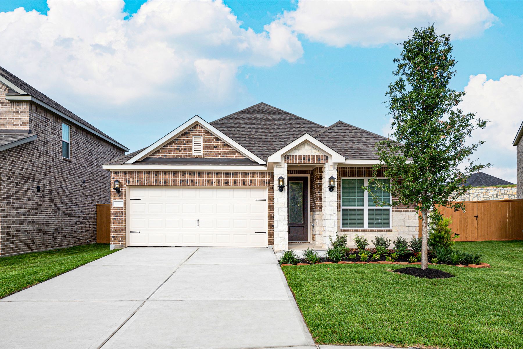 The Basswood by LGI Homes:This beautiful single story home has brick and stone and front yard landscaping!