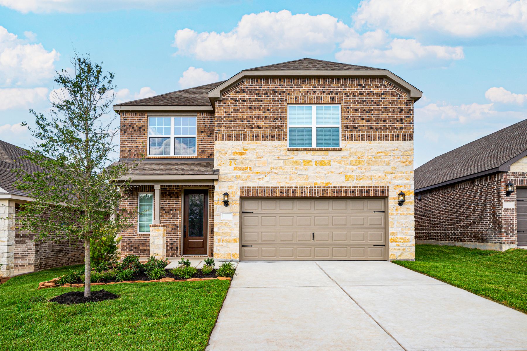 The Sequoia by LGI Homes:This beautiful two-story home has brick and stone and front yard landscaping!