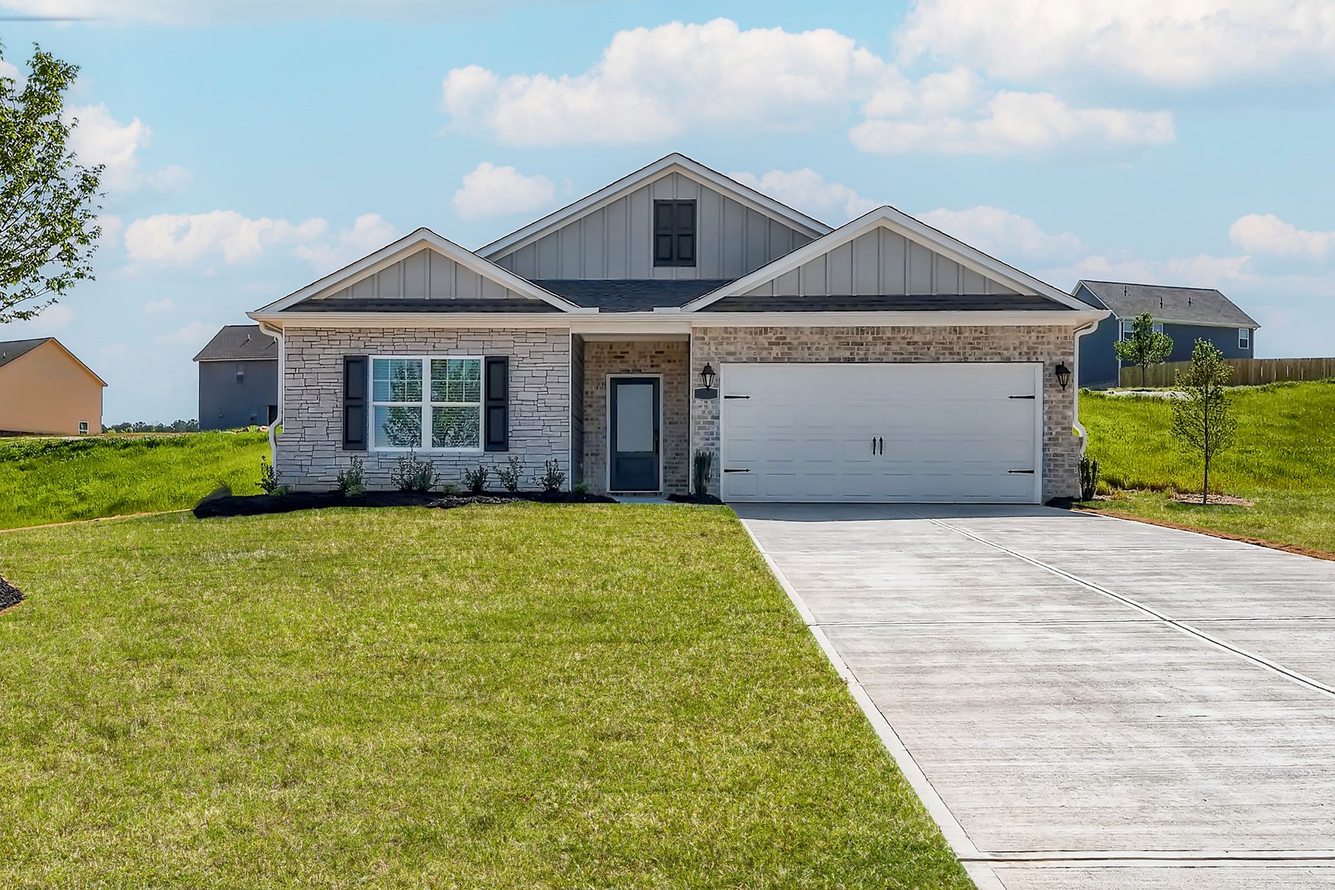 The Burton at Bunn Farms by LGI Homes:Beautiful landscaping on the Burton by LGI Homes