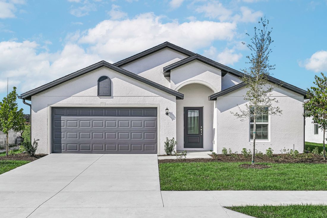 The Estero by LGI Homes:Be welcomed into the Estero by walking through the beautiful arched entryway and into the 3/4 lite door