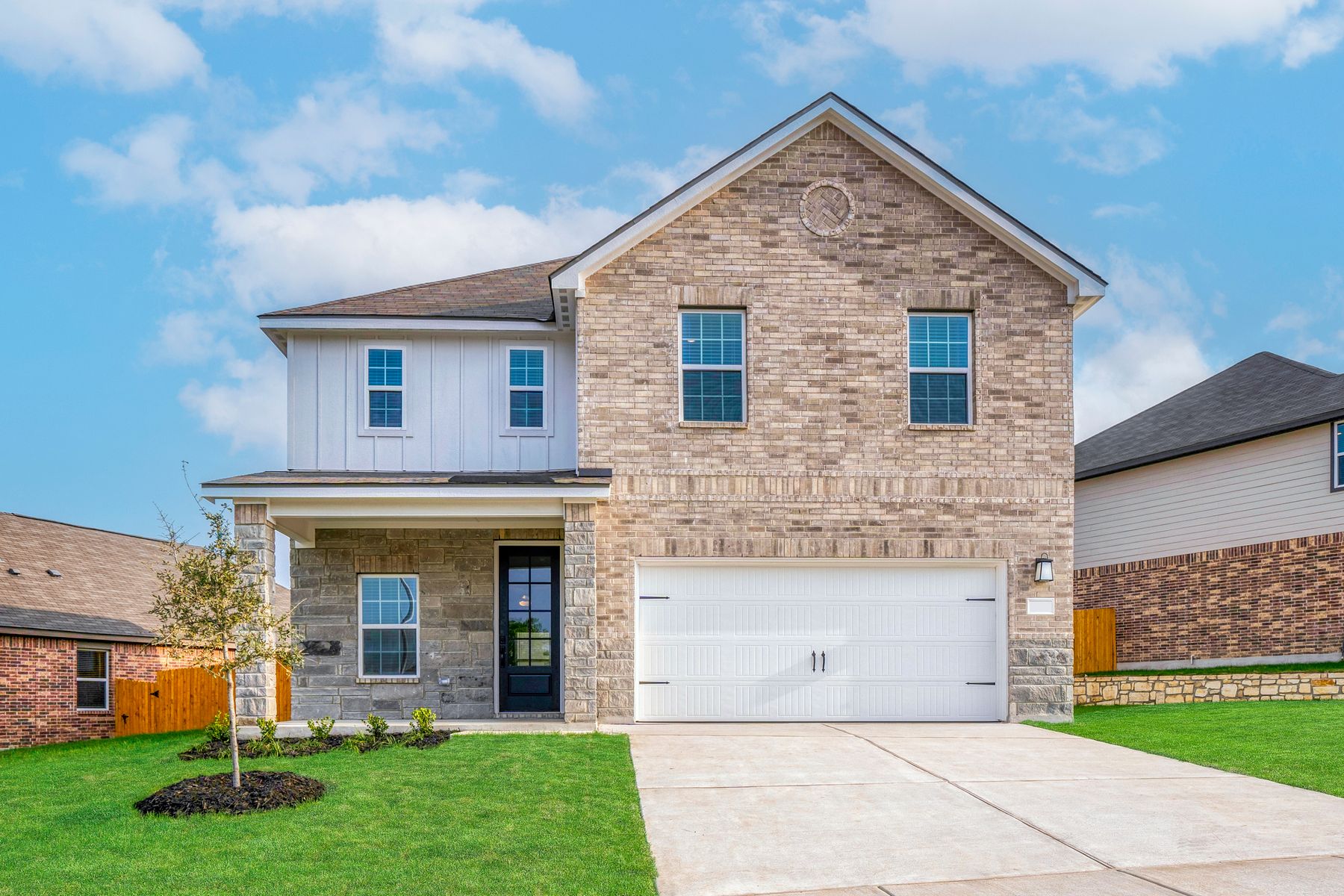 Exterior of the Shelby with siding, brick and stone.:LGI Homes at Hightop Ridge