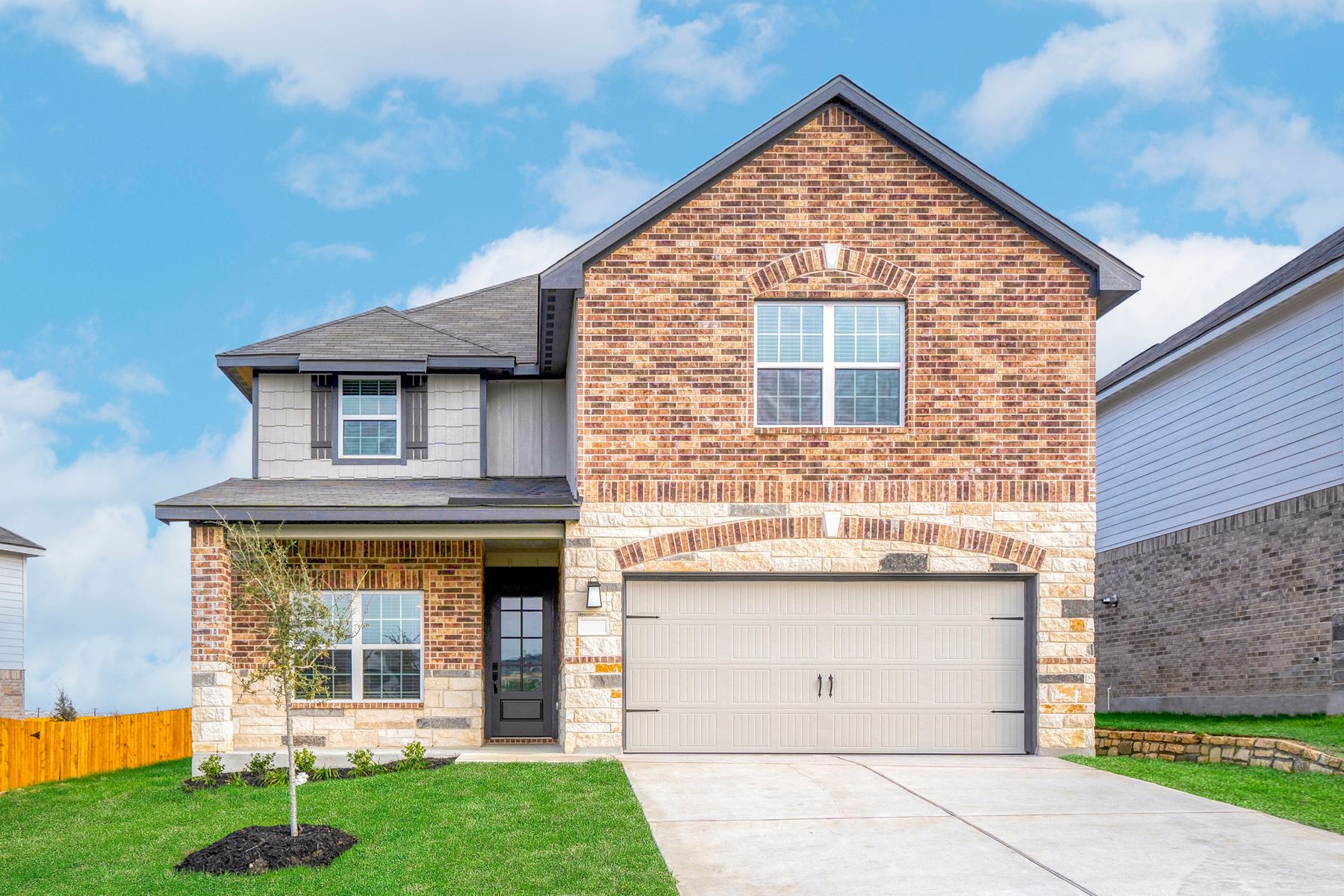 Exterior of the Webb with stone and brick finishes.:LGI Homes at Hightop Ridge