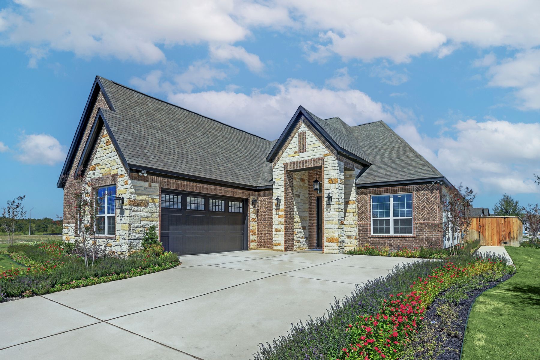 Angled exterior of the Hanna plan, showcasing the swing garage.:Terrata Homes at ShadowGlen