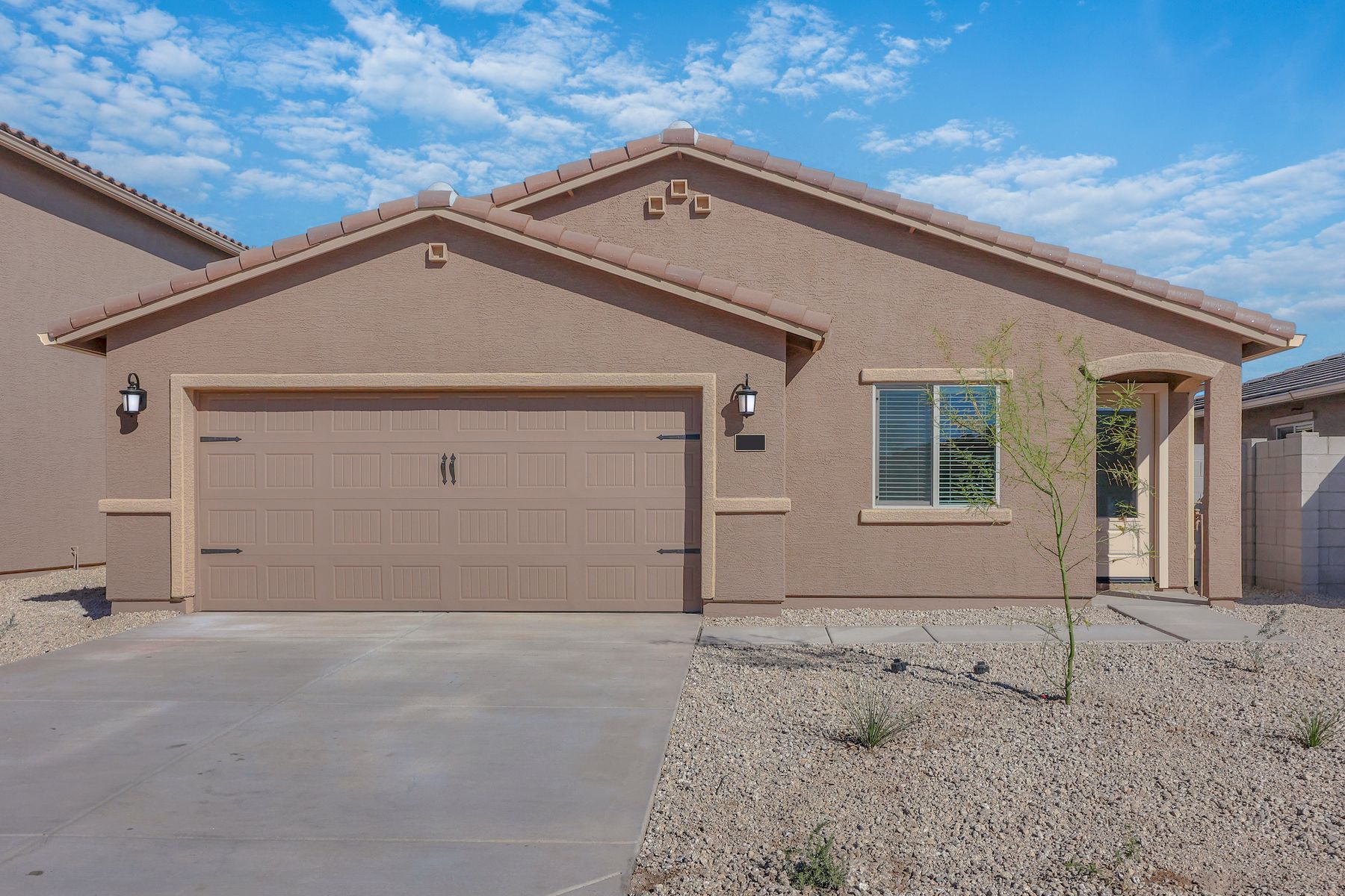 This home has a 2-car garage and a gorgeous stucco exterior.