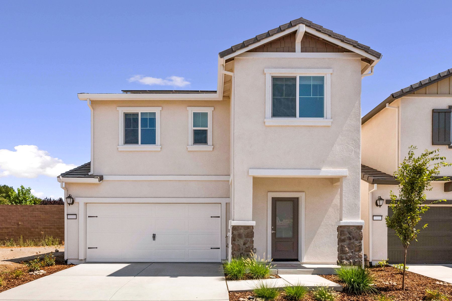 The Willow by LGI Homes:The Willow is a beautiful home with stucco and stone.