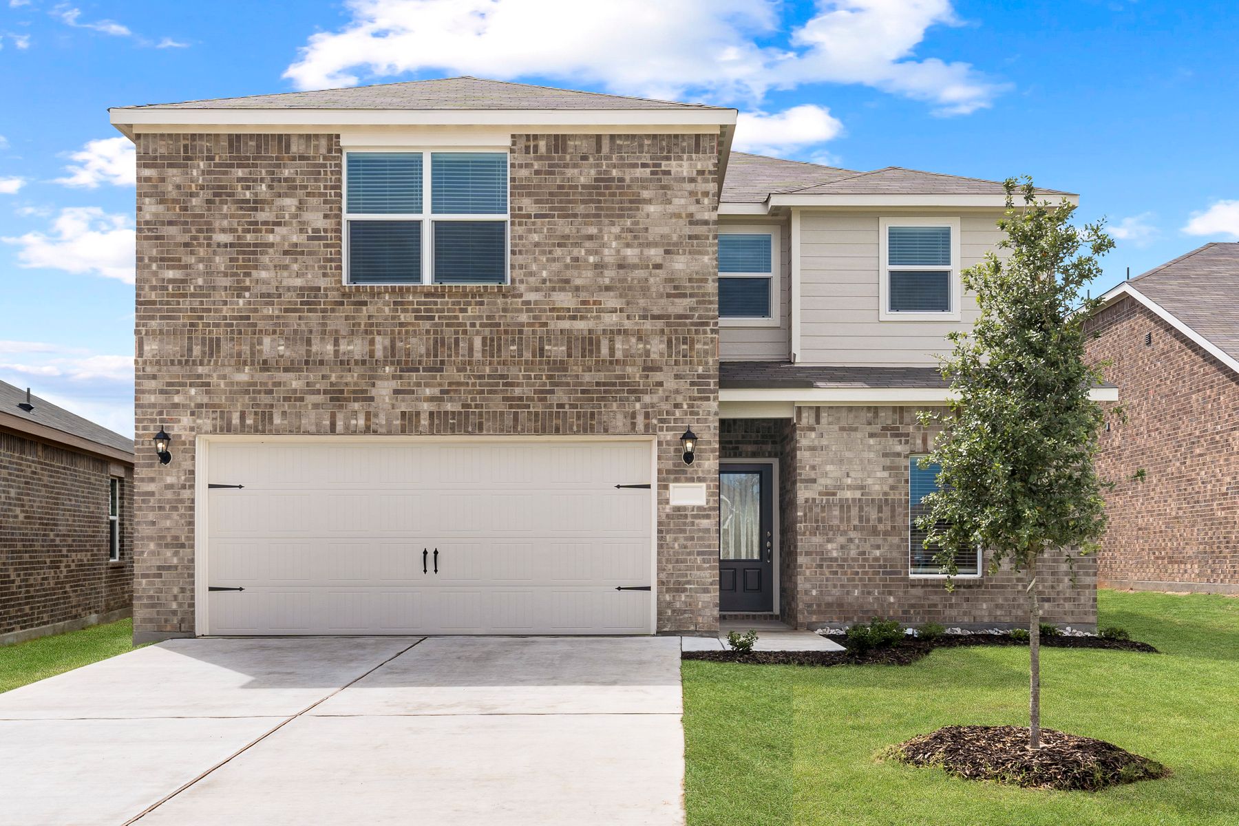 The Driftwood by LGI Homes:The Driftwood is a beautiful two-story, brick home with siding details.