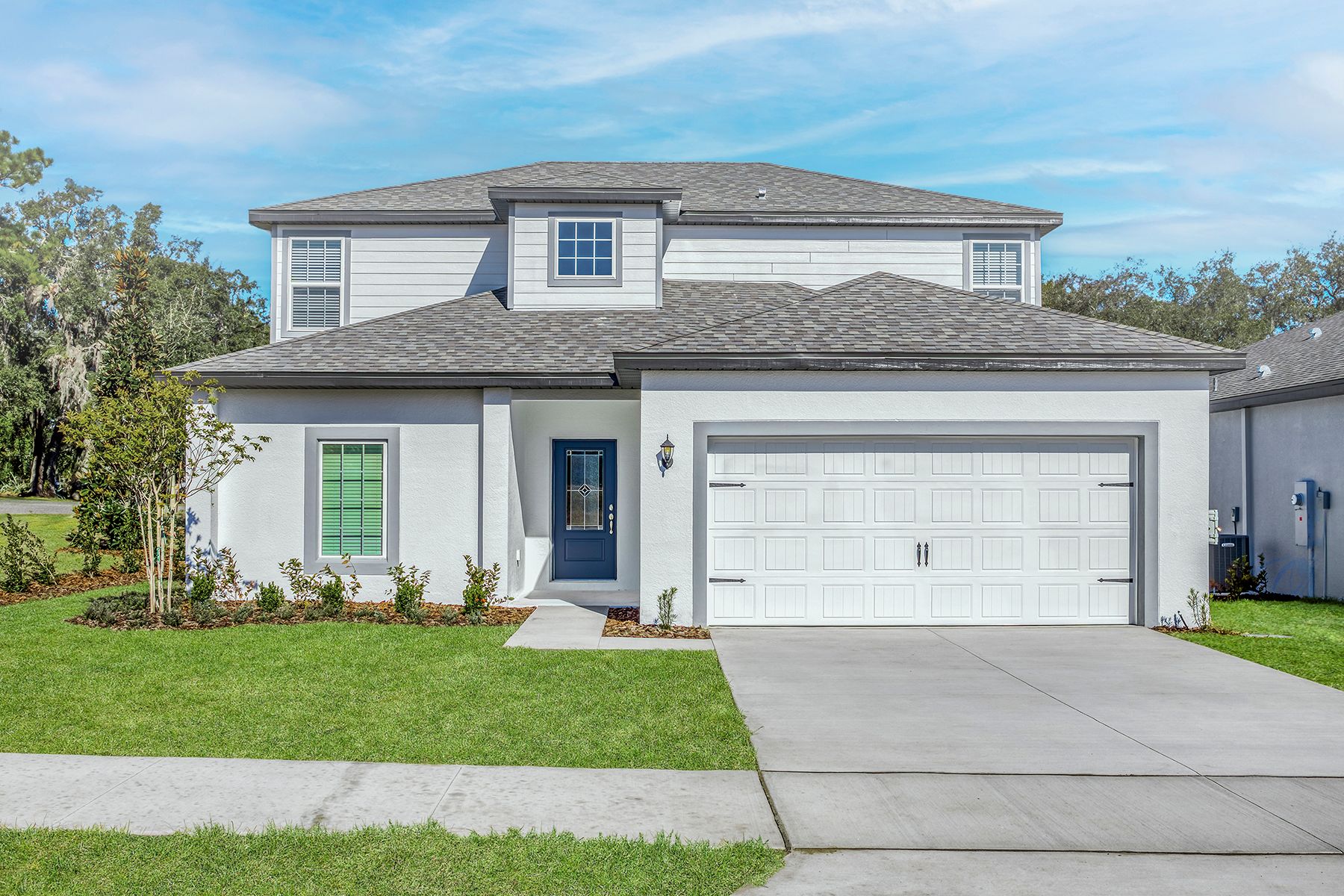The two-story Useppa plan with a two-car garage