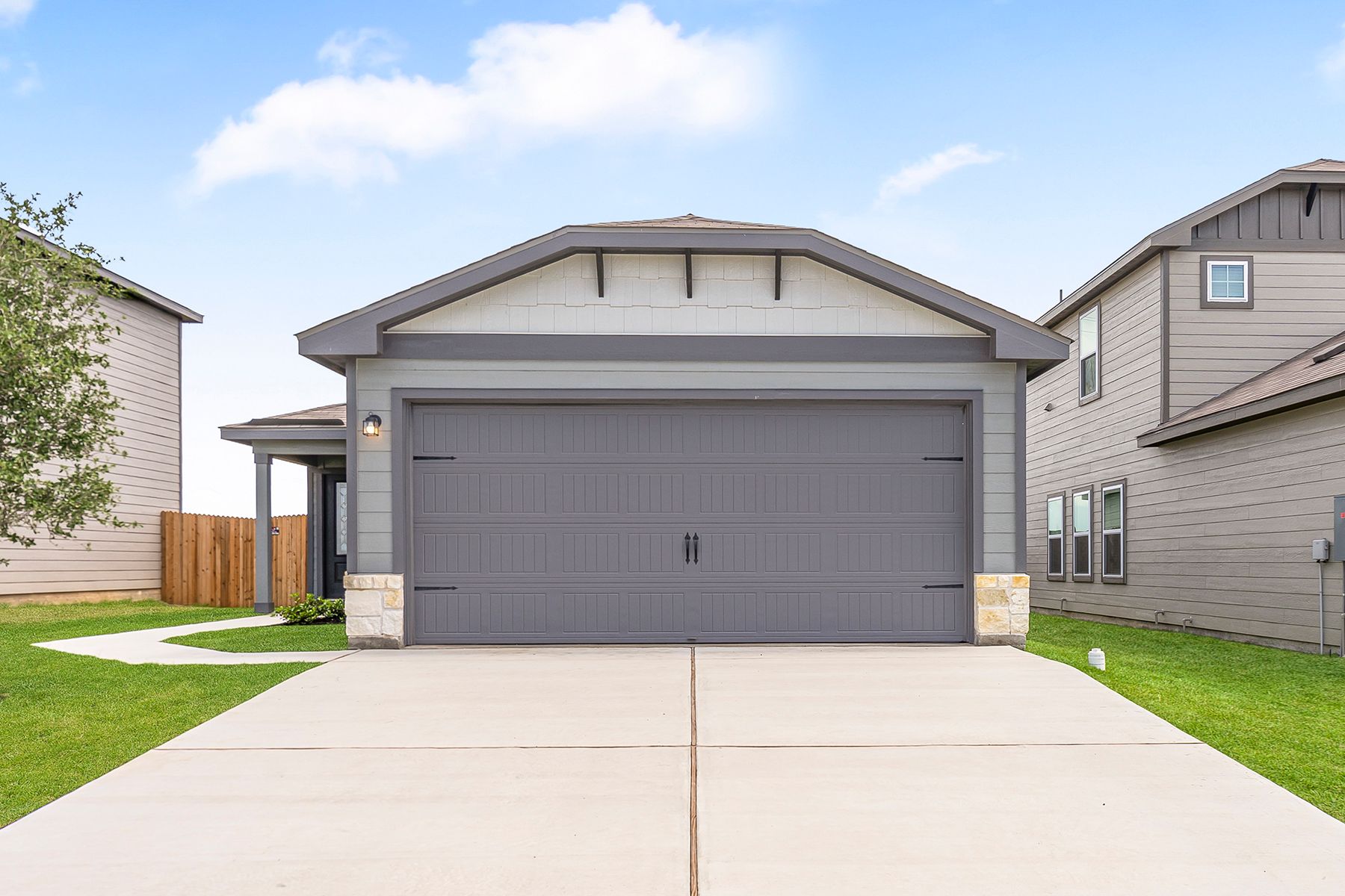 The exterior Chestnut by LGI Homes with stone detail