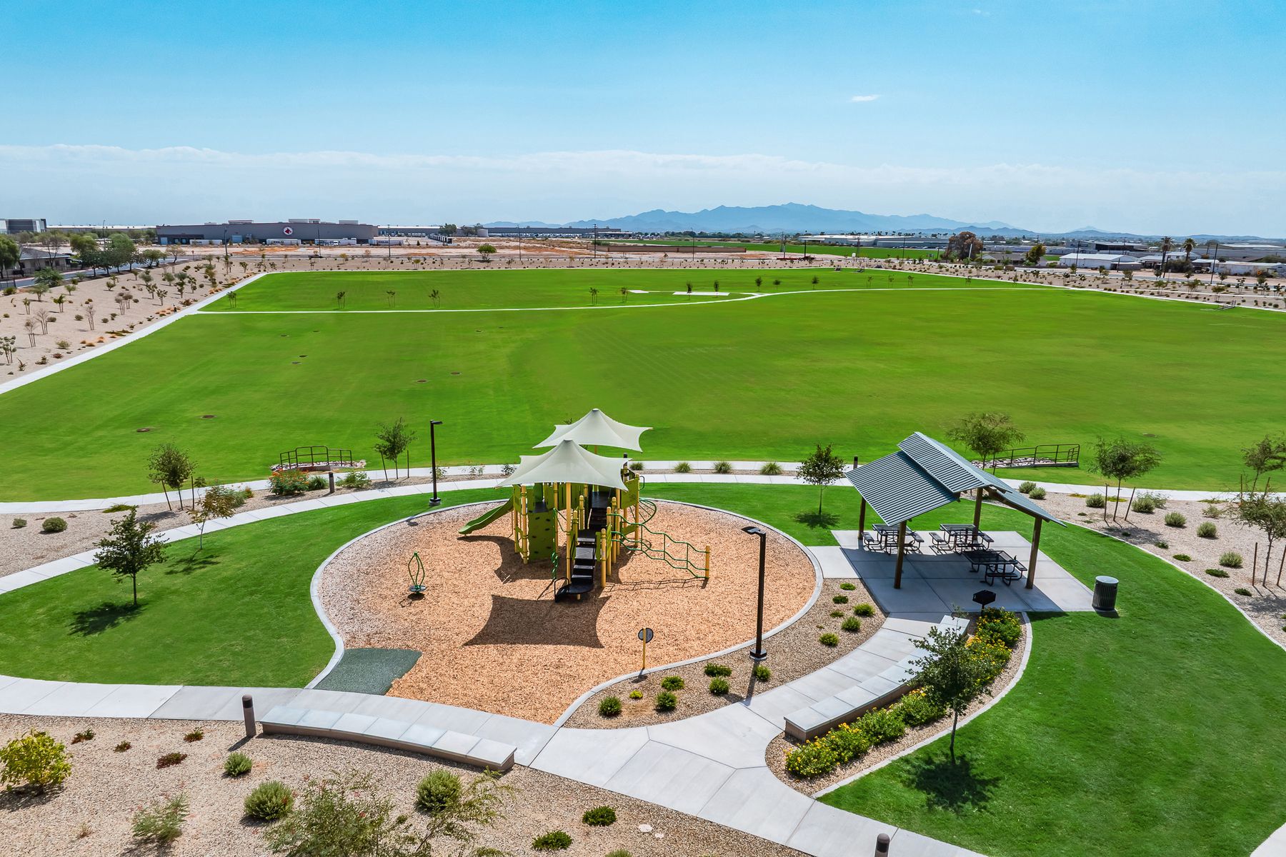 A large open green space is the perfect area for a quick game of soccer.