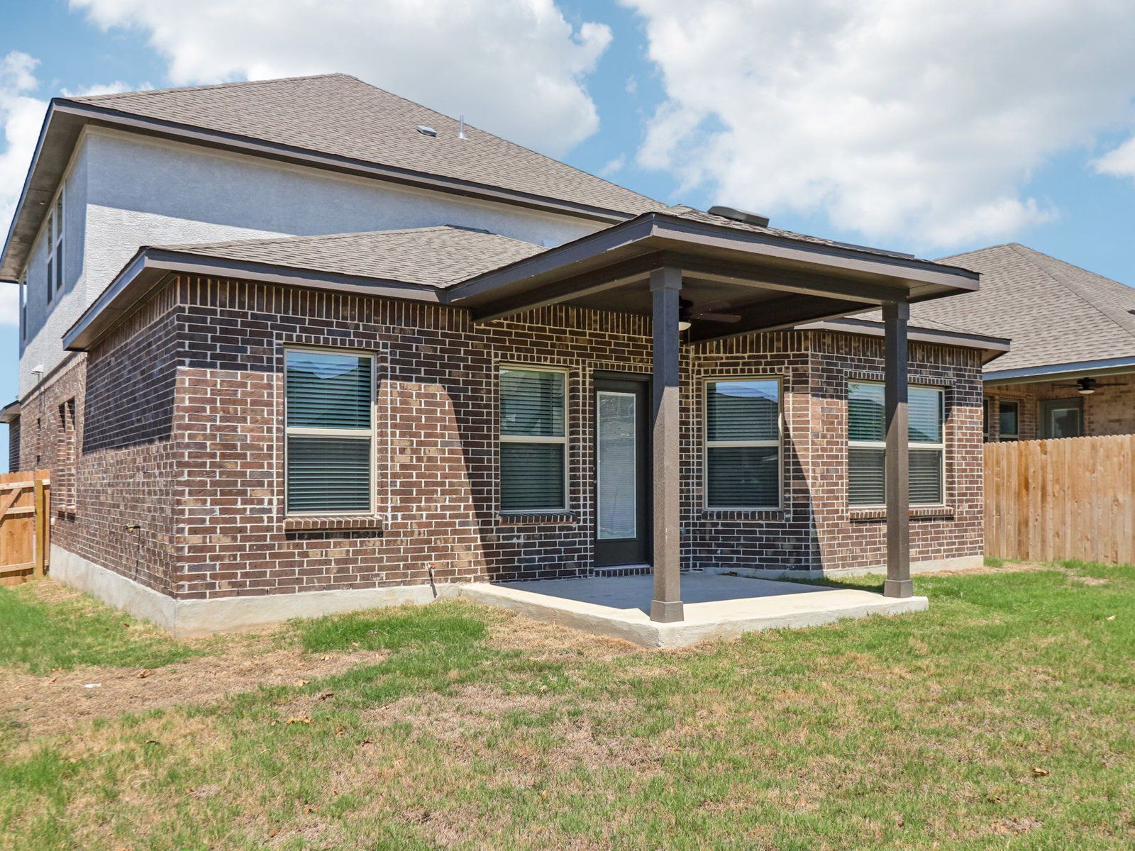 Back Exterior:Back exterior of the Reynolds floorplan at a Meritage Homes community.