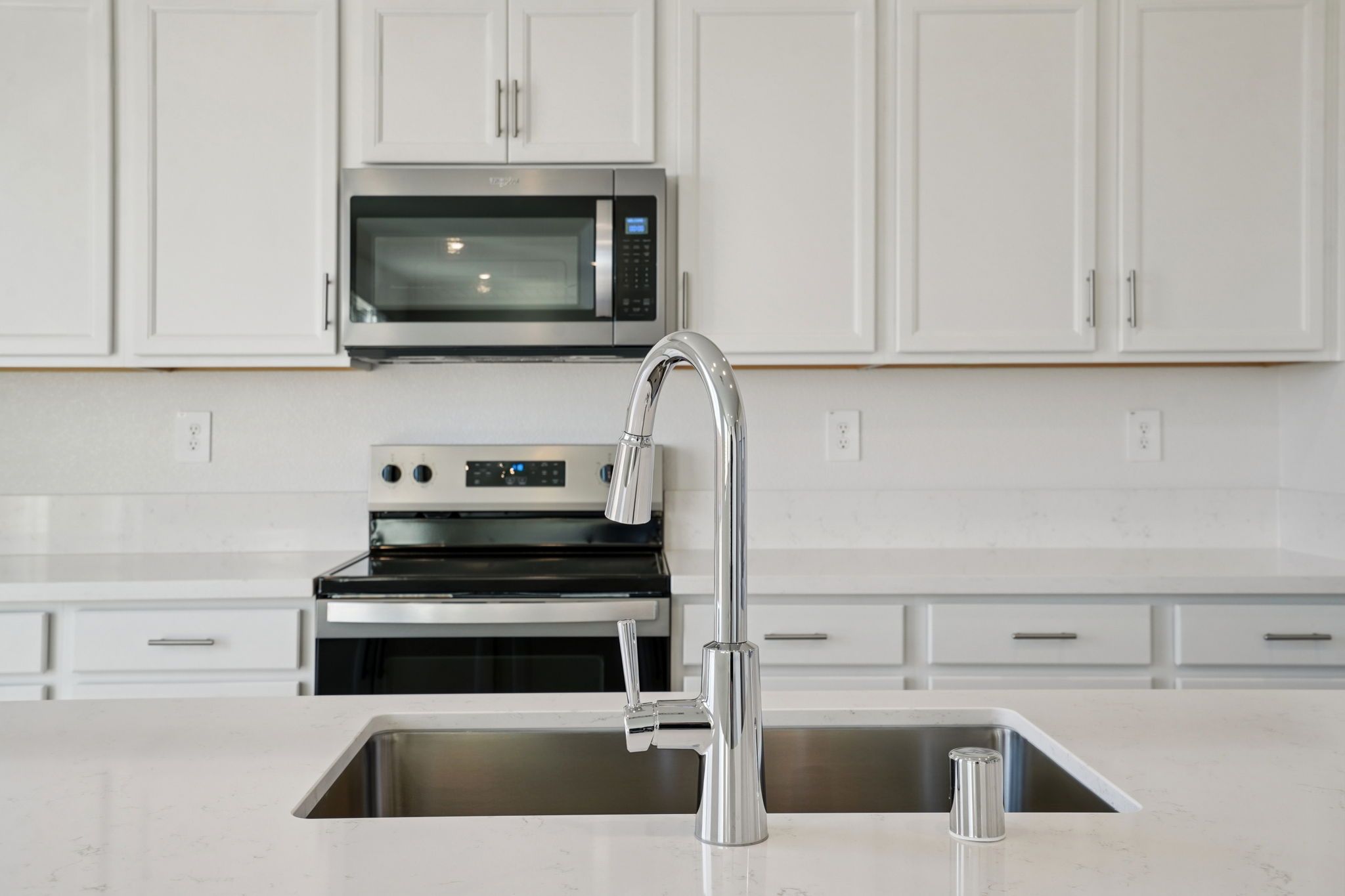Kitchen:A modeled 4021 plan at a nearby Meritage Homes community