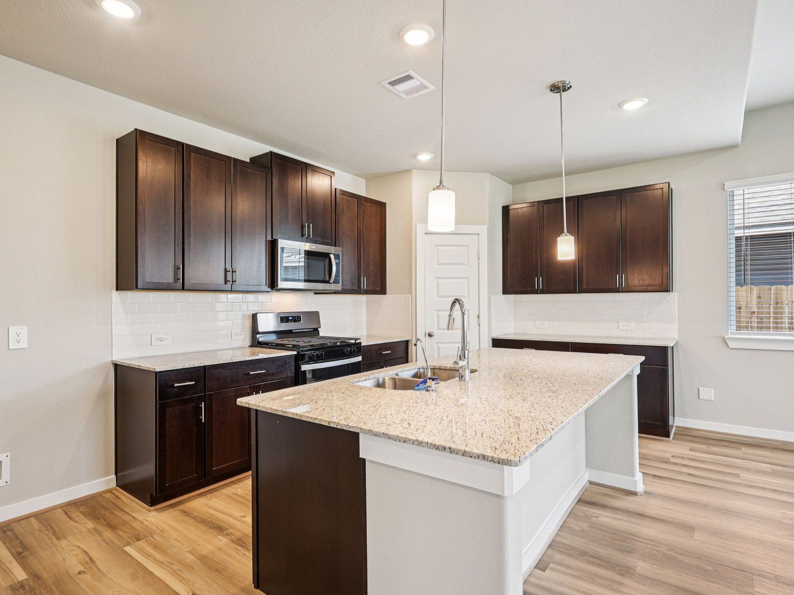 The Texoma floorplan in Glendale Lakes of Rosharon, TX.:Kitchen