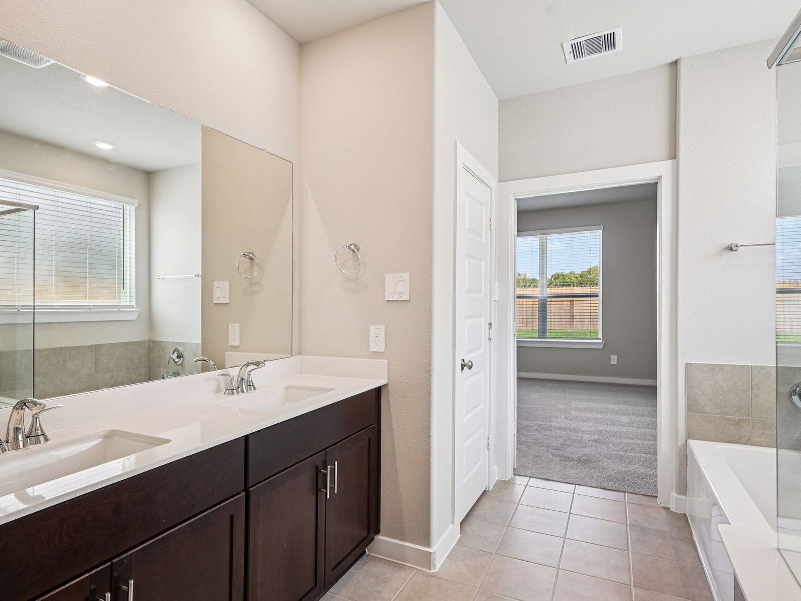 Primary Bathroom:The Texoma floorplan in Glendale Lakes of Rosharon, TX.