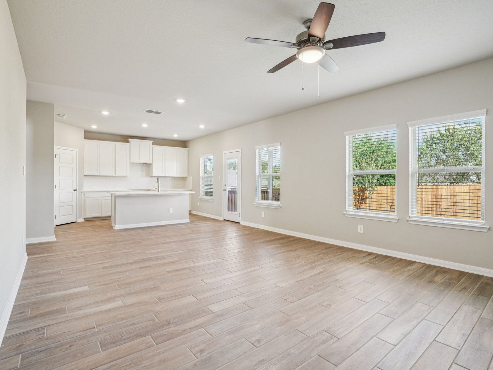 Living Room &amp; Kitchen:Living Room &amp; Kitchen in the McCoy floorplan at a Meritage Homes community.
