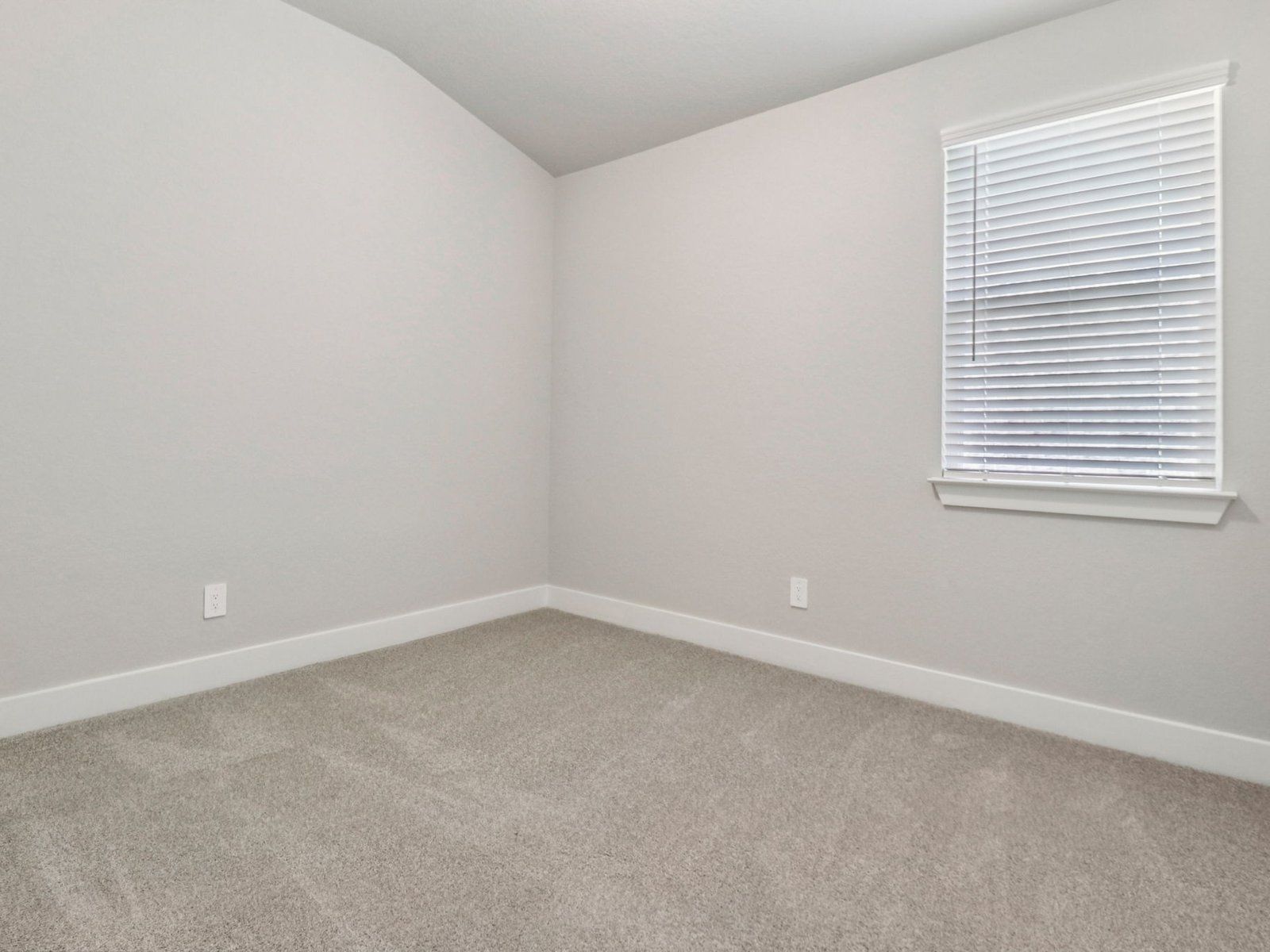 Guest bedroom in the Holly floorplan in a Meritage Homes community.:Guest Bedroom