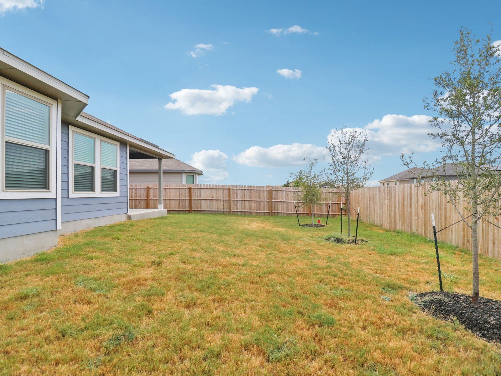 Back exterior of the Callaghan floorplan at a Meritage Homes community.:Back Exterior
