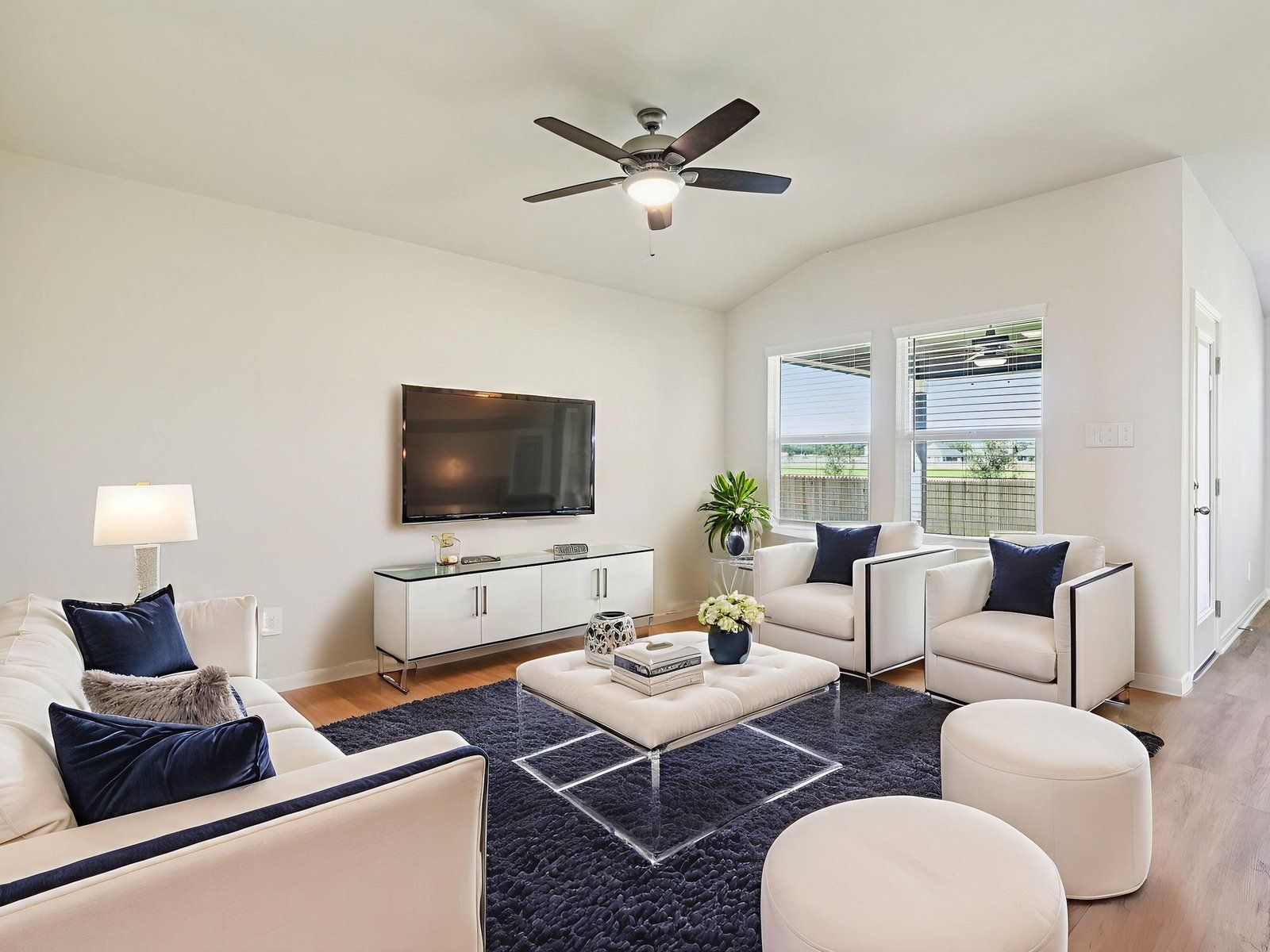 Virtually staged living room in the Briscoe floorplan at a Meritage Homes community.:Virtually Staged Living Room