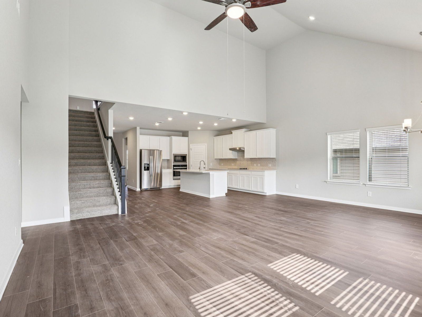 Living &amp; Kitchen:Living &amp; kitchen in the Kessler floorplan at a Meritage Homes community.