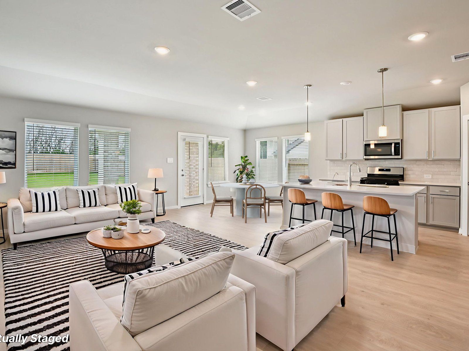 The Henderson floorplan in Kingdom Heights of Rosenberg, TX.:Living Room