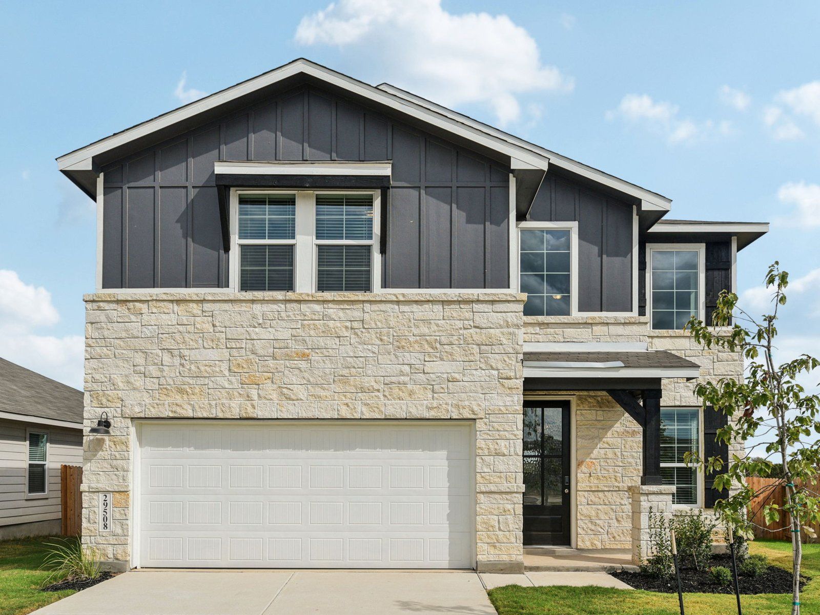 Front exterior of the Medina floorplan at a Meritage Homes community.:Front Exterior