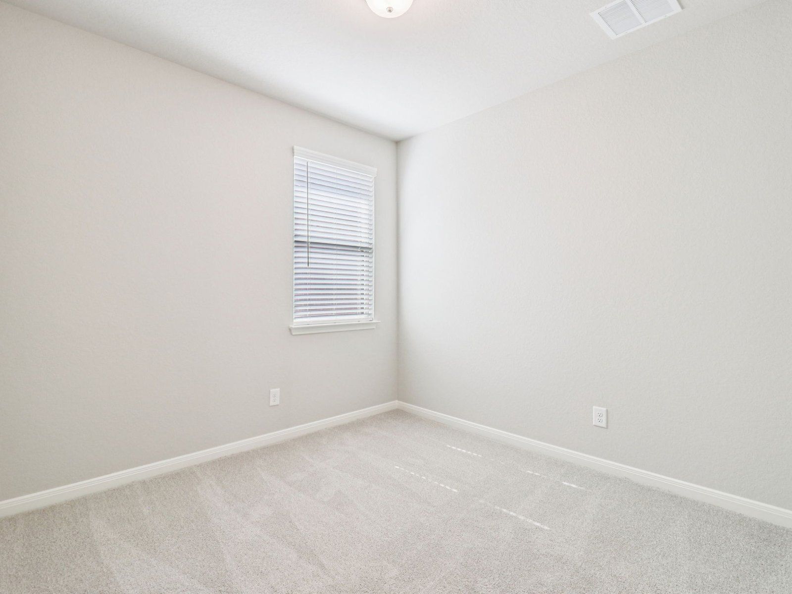 Guest bedroom in the San Saba floorplan at a Meritage Homes community.:Guest Bedroom